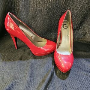 Red patten leather high heeled shoe.